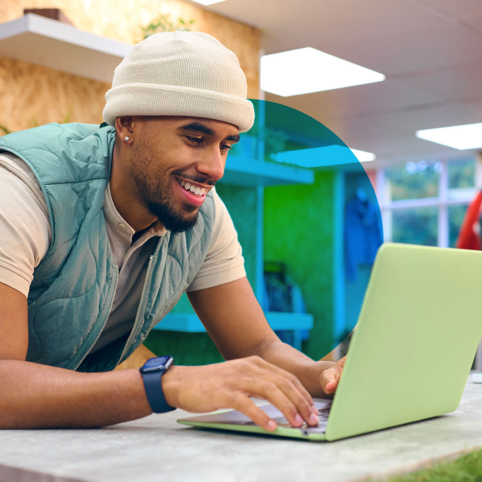 retail worker using a laptop