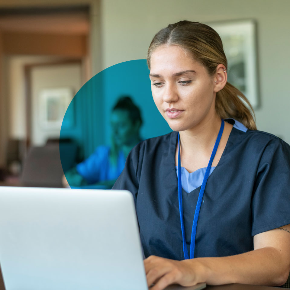 newly qualified nurse using a laptop